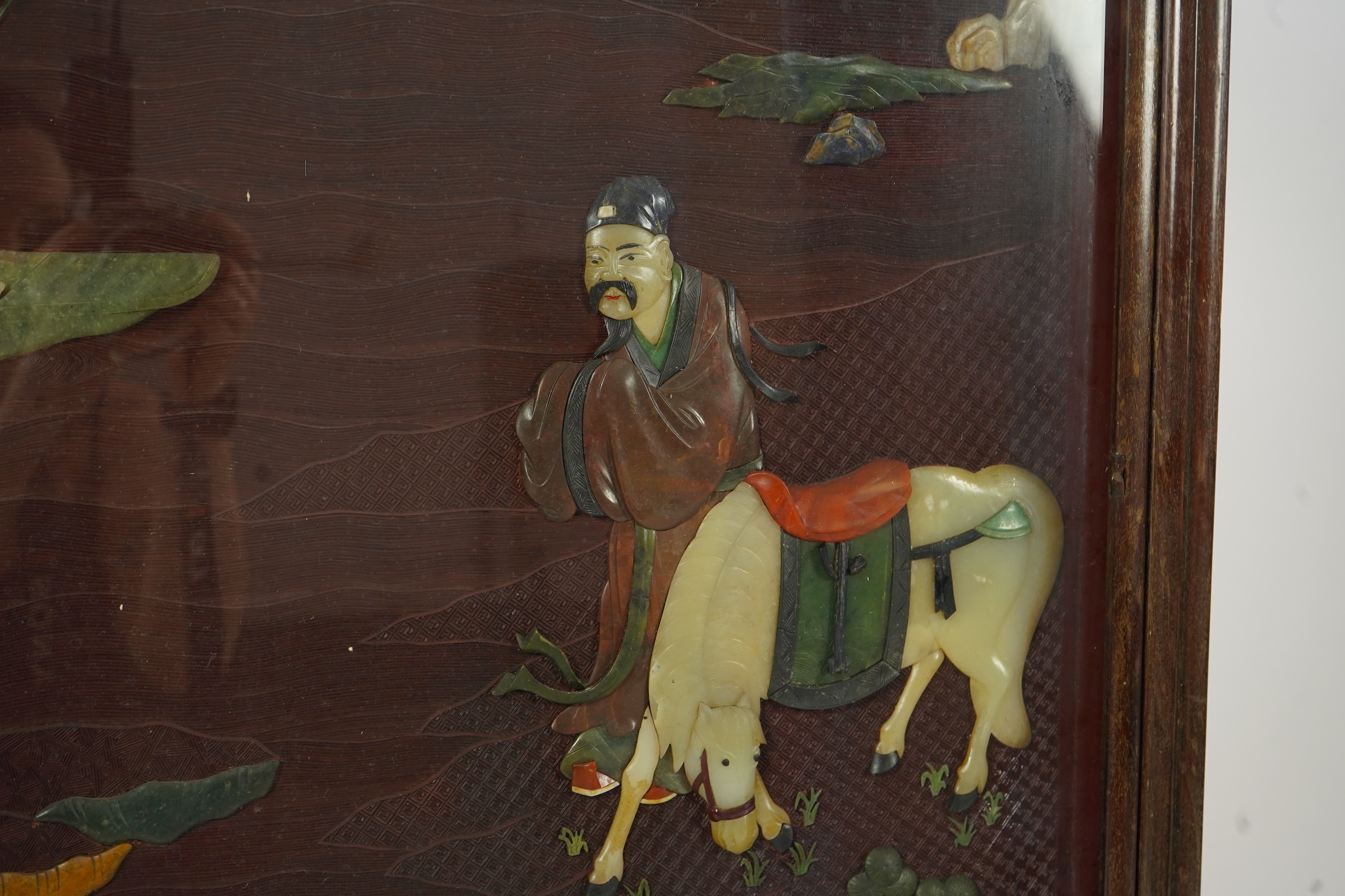 A Chinese carved cinnabar lacquer and hardstone mounted panel, early 20th century